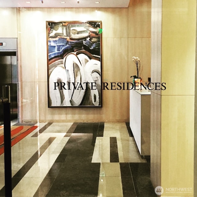 99 Union St Unit 1601, Seattle, WA 98101 - corridor with recessed lighting, tile walls, and tile patterned flooring
