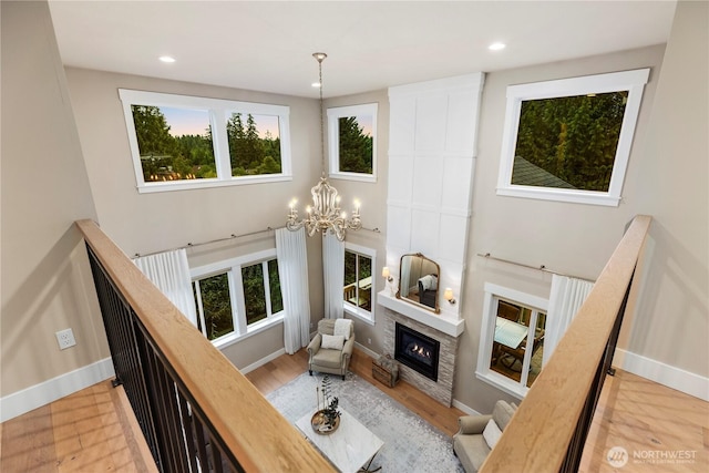 230 155th Pl SE, Bothell, WA 98012 - living room with a chandelier, a fireplace, recessed lighting, and wood finished floors