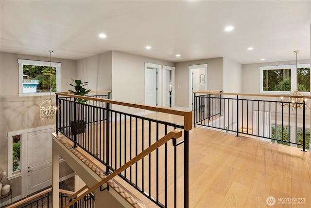230 155th Pl SE, Bothell, WA 98012 - hall with an upstairs landing, recessed lighting, wood finished floors, a chandelier, and plenty of natural light