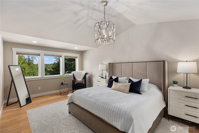 230 155th Pl SE, Bothell, WA 98012 - bedroom with light wood-type flooring, lofted ceiling, a chandelier, and recessed lighting