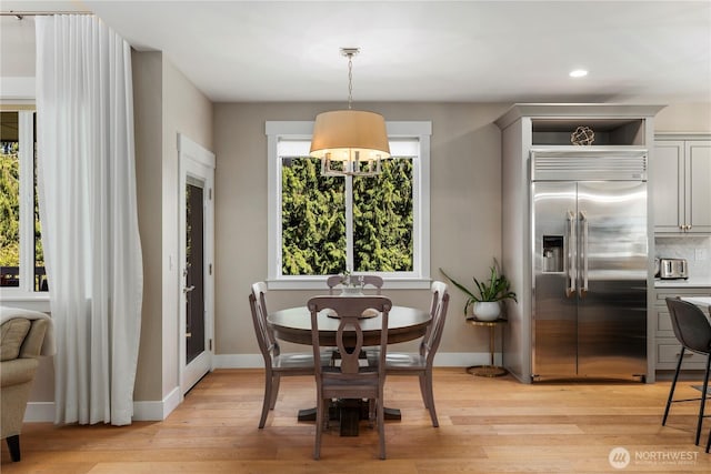 230 155th Pl SE, Bothell, WA 98012 - dining space featuring light wood finished floors and recessed lighting