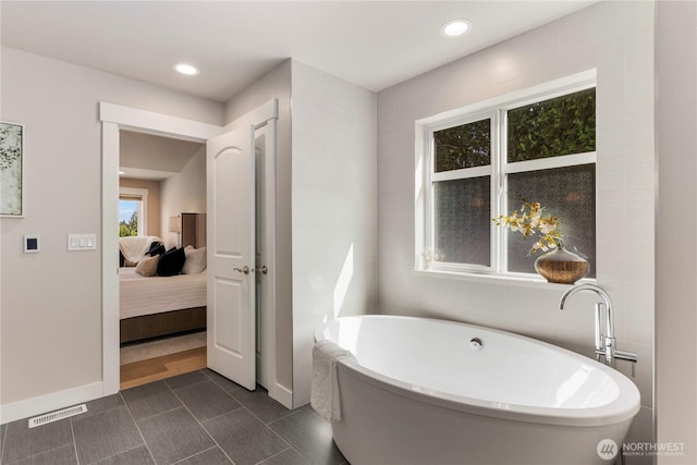 230 155th Pl SE, Bothell, WA 98012 - ensuite bathroom featuring a freestanding bath and recessed lighting