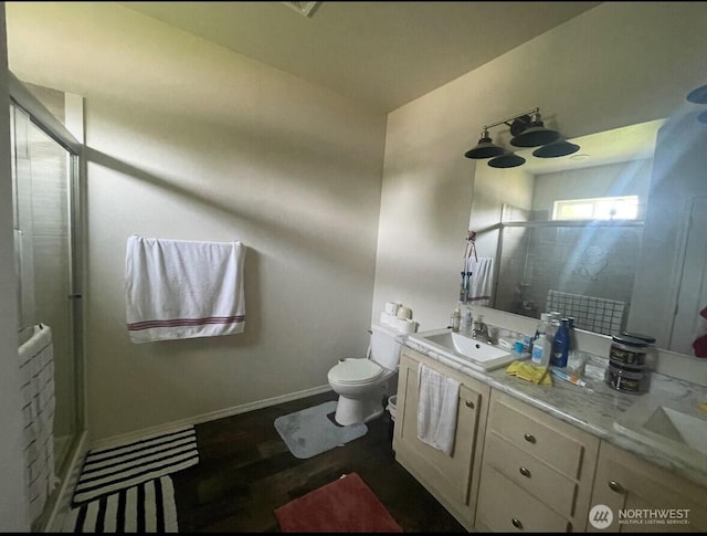 1720 Maple Ln Unit 33, Kent, WA 98031 - bathroom featuring a stall shower, double vanity, and wood finished floors