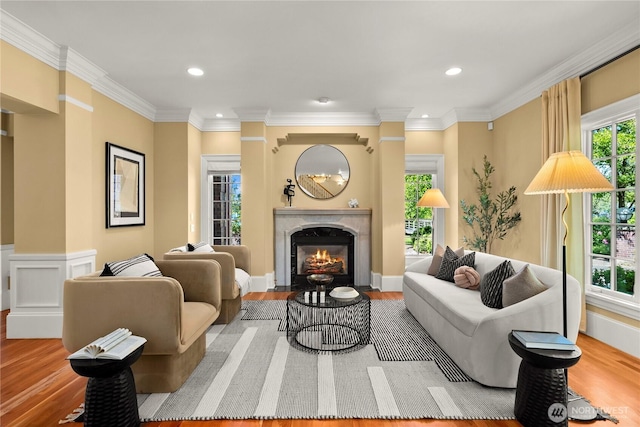 2530 39th Ave E, Seattle, WA 98112 - living room featuring wood finished floors, a fireplace, recessed lighting, and crown molding