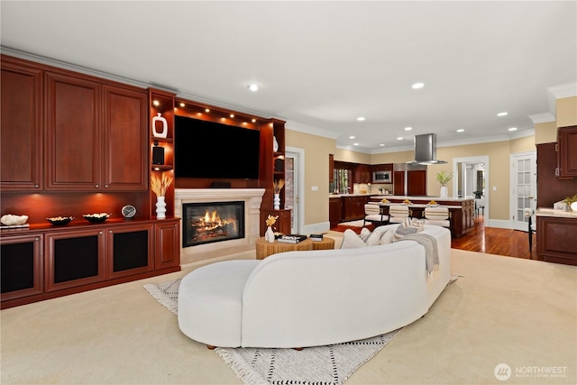 2530 39th Ave E, Seattle, WA 98112 - living area featuring a glass covered fireplace, recessed lighting, crown molding, and wood finished floors