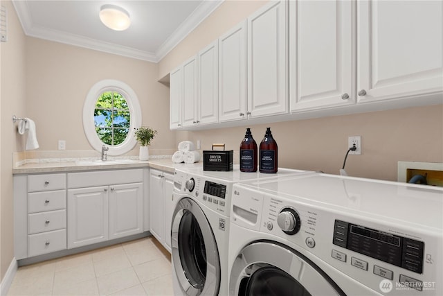 2530 39th Ave E, Seattle, WA 98112 - laundry area featuring washing machine and dryer, crown molding, cabinet space, and light tile patterned floors