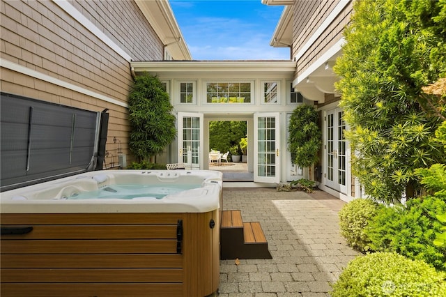2530 39th Ave E, Seattle, WA 98112 - view of patio featuring french doors and a hot tub