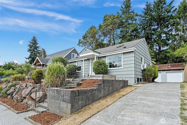 7147 29th Ave SW, Seattle, WA 98126 - ranch-style home featuring asphalt driveway, a garage, a shingled roof, and stairway