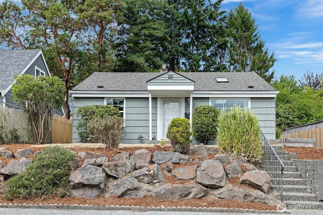 7147 29th Ave SW, Seattle, WA 98126 - view of front of property with a shingled roof and stairs