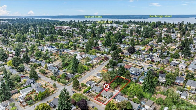 7147 29th Ave SW, Seattle, WA 98126 - aerial perspective of suburban area featuring property parcel outlined and a large body of water