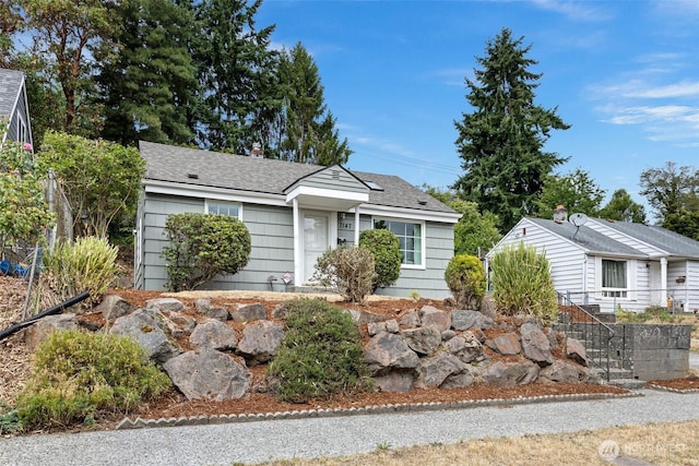 7147 29th Ave SW, Seattle, WA 98126 - view of front facade featuring a shingled roof