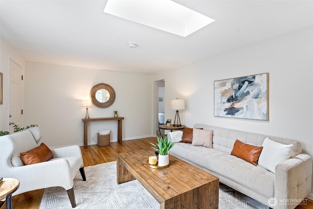 7147 29th Ave SW, Seattle, WA 98126 - living room featuring a skylight and light wood-style flooring