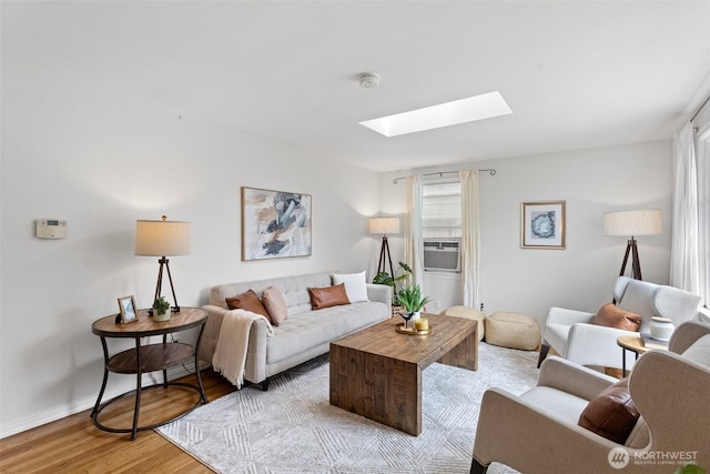 7147 29th Ave SW, Seattle, WA 98126 - living area with a skylight, plenty of natural light, and light wood finished floors