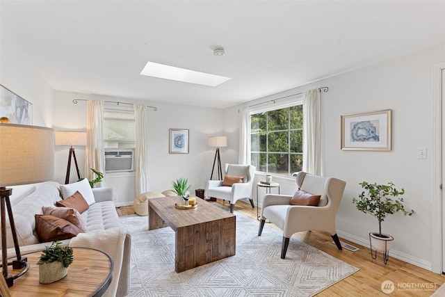 7147 29th Ave SW, Seattle, WA 98126 - living room featuring a skylight and light wood finished floors