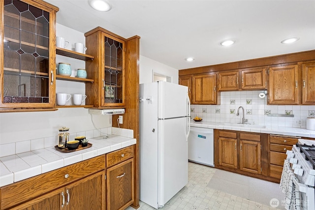 7147 29th Ave SW, Seattle, WA 98126 - kitchen featuring white appliances, brown cabinetry, glass insert cabinets, open shelves, and decorative backsplash