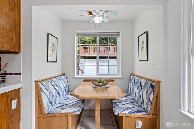 7147 29th Ave SW, Seattle, WA 98126 - dining room with ceiling fan and tile patterned flooring