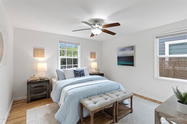 7147 29th Ave SW, Seattle, WA 98126 - bedroom with light wood finished floors and ceiling fan
