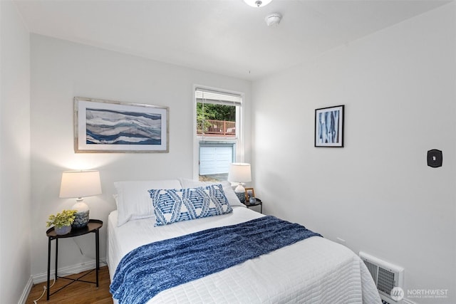 7147 29th Ave SW, Seattle, WA 98126 - bedroom featuring wood finished floors and baseboards