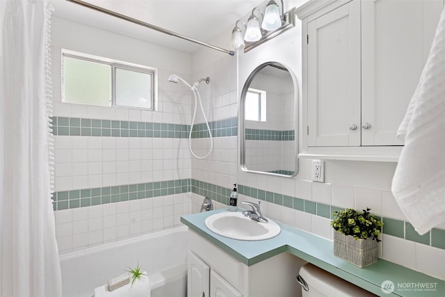 7147 29th Ave SW, Seattle, WA 98126 - bathroom featuring shower / bathtub combination with curtain, vanity, and tasteful backsplash
