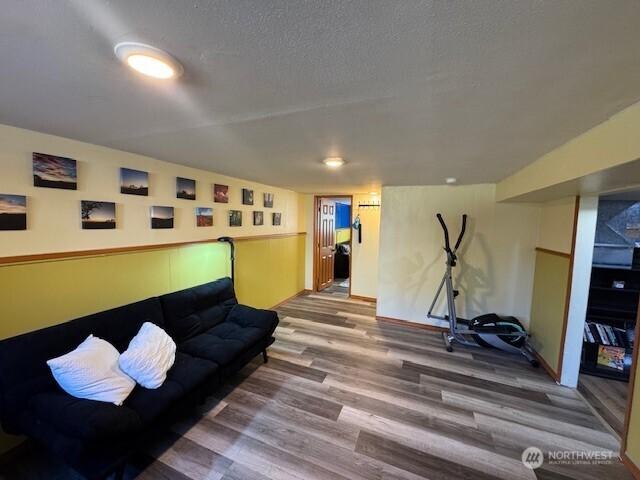 7147 29th Ave SW, Seattle, WA 98126 - workout area with wood finished floors and a textured ceiling
