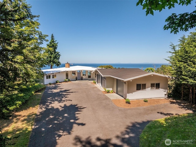2641 E Bay St, Port Angeles, WA 98362 - single story home with asphalt driveway, a water view, and a chimney