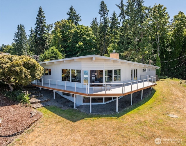 2641 E Bay St, Port Angeles, WA 98362 - rear view of property featuring a chimney, a yard, and a wooden deck