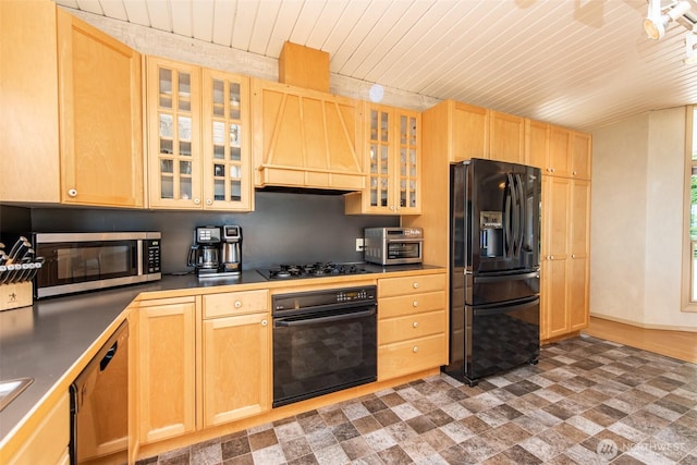 2641 E Bay St, Port Angeles, WA 98362 - kitchen featuring black appliances, premium range hood, light brown cabinets, glass insert cabinets, and wooden ceiling