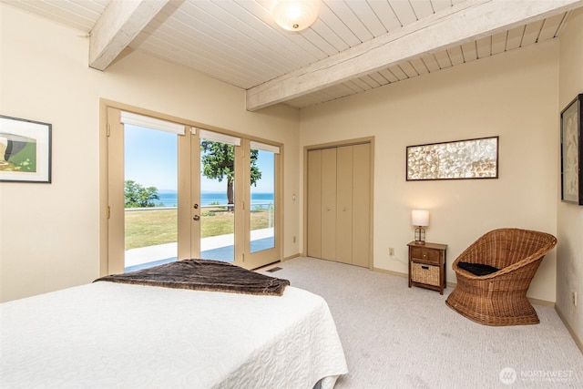 2641 E Bay St, Port Angeles, WA 98362 - bedroom with access to exterior, light colored carpet, a water view, a wooden ceiling with exposed beams, and french doors