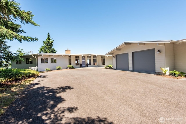 2641 E Bay St, Port Angeles, WA 98362 - ranch-style house featuring a garage, driveway, and a chimney