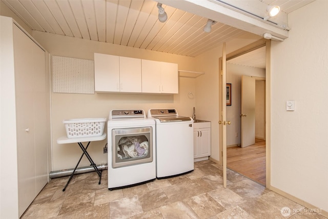 2641 E Bay St, Port Angeles, WA 98362 - laundry room featuring separate washer and dryer, cabinet space, light stone finish flooring, and wooden ceiling