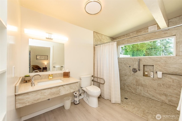 2641 E Bay St, Port Angeles, WA 98362 - bathroom with wood finished floors, tiled shower, and vanity