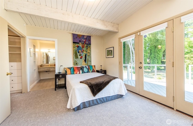 2641 E Bay St, Port Angeles, WA 98362 - carpeted bedroom with access to outside, french doors, connected bathroom, and a wooden ceiling with exposed beams