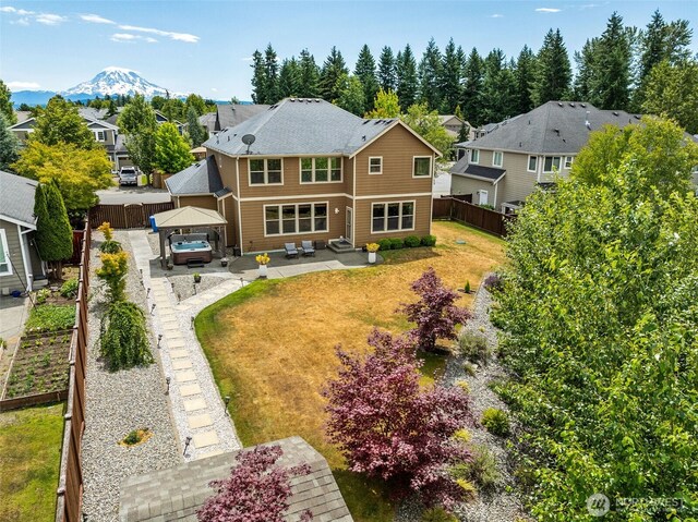 17116 138th Ave E, Puyallup, WA 98374 - back of property featuring a patio, a gazebo, a fenced backyard, and a residential view