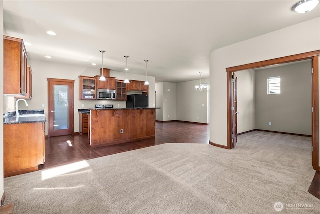 2309 43rd Ave SE, Puyallup, WA 98374 - kitchen featuring stainless steel microwave, freestanding refrigerator, dark colored carpet, dark countertops, and recessed lighting