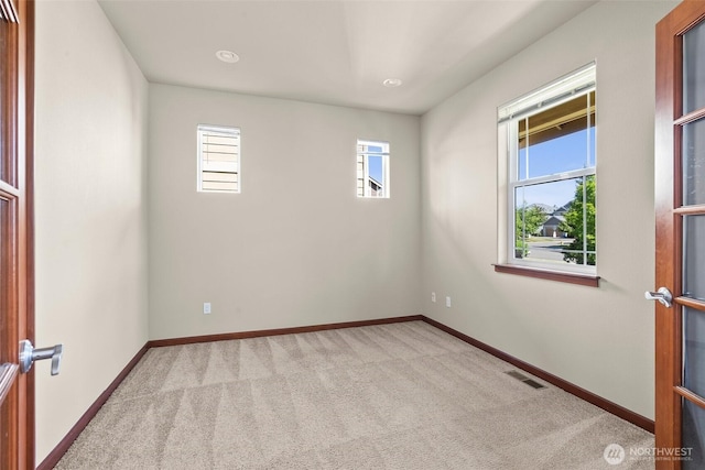 2309 43rd Ave SE, Puyallup, WA 98374 - carpeted empty room with baseboards and recessed lighting