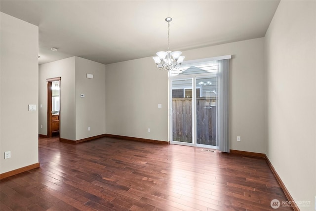2309 43rd Ave SE, Puyallup, WA 98374 - empty room featuring dark wood-type flooring and a chandelier