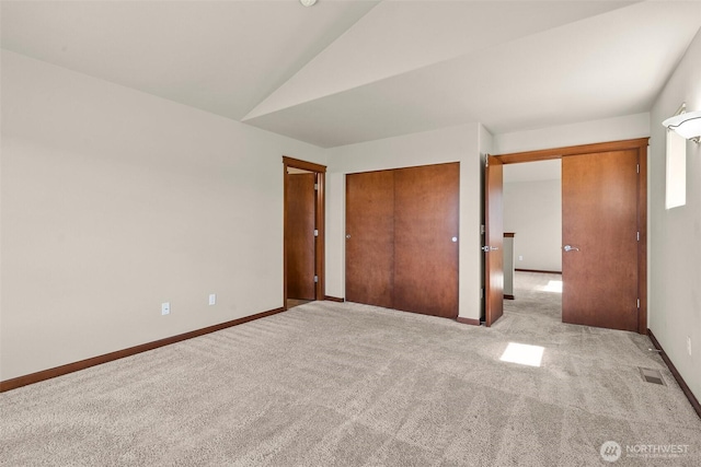 2309 43rd Ave SE, Puyallup, WA 98374 - unfurnished bedroom featuring carpet floors, vaulted ceiling, and a closet