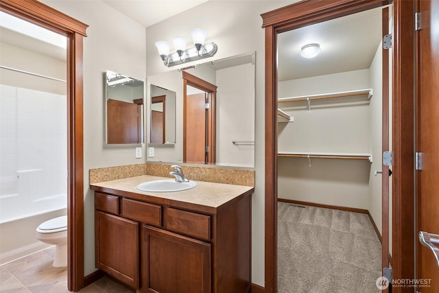 2309 43rd Ave SE, Puyallup, WA 98374 - full bathroom featuring vanity, a walk in closet, and washtub / shower combination