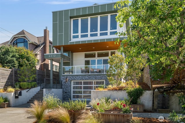 6012 Palatine Ave N, Seattle, WA 98103 - back of property with stairway, stucco siding, a balcony, and stone siding