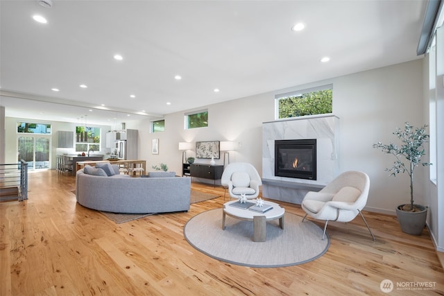 6012 Palatine Ave N, Seattle, WA 98103 - living room with light wood finished floors, a premium fireplace, and recessed lighting