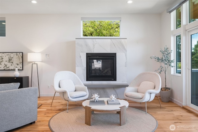 6012 Palatine Ave N, Seattle, WA 98103 - living room with a premium fireplace, recessed lighting, healthy amount of natural light, and wood finished floors