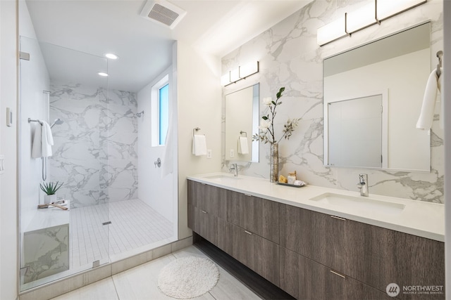 6012 Palatine Ave N, Seattle, WA 98103 - full bathroom featuring double vanity, a marble finish shower, recessed lighting, and tile patterned flooring