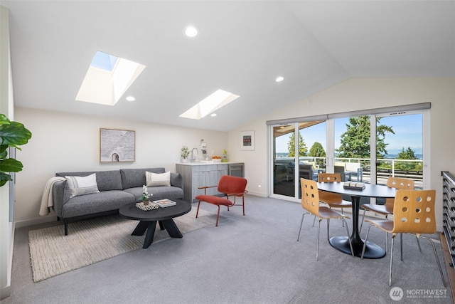 6012 Palatine Ave N, Seattle, WA 98103 - carpeted living room with a skylight, vaulted ceiling, wine cooler, and recessed lighting