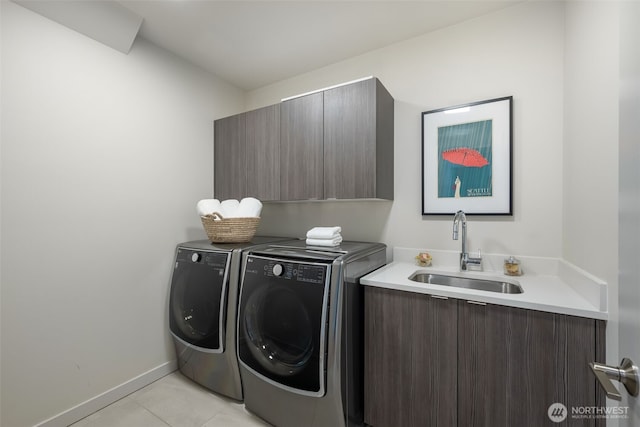 6012 Palatine Ave N, Seattle, WA 98103 - washroom with cabinet space, washing machine and clothes dryer, and light tile patterned floors