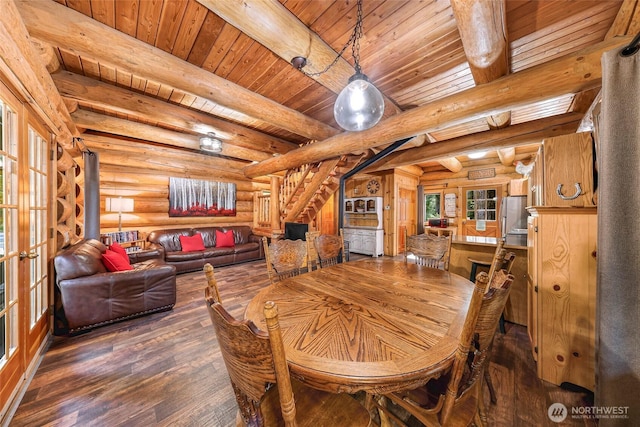 7010 Rainier Way, Deming, WA 98244 - dining room featuring log walls, hardwood / wood-style flooring, a wooden ceiling with exposed beams, stairs, and french doors