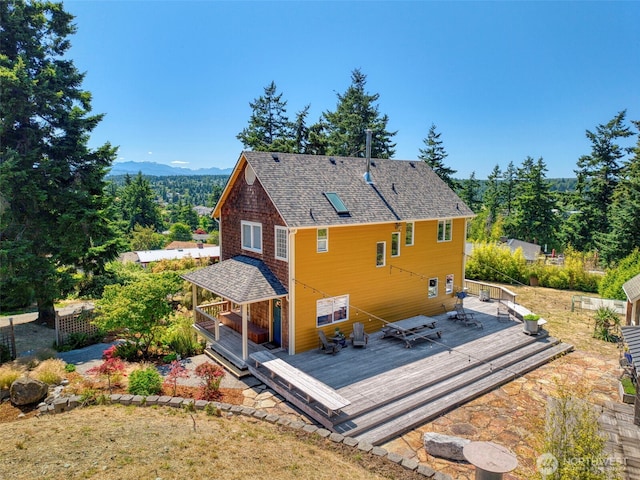 788 P St, Port Townsend, WA 98368 - rear view of property featuring a deck with mountain view