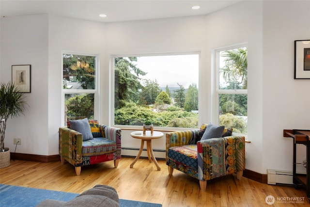 788 P St, Port Townsend, WA 98368 - living area featuring baseboard heating, wood finished floors, and recessed lighting