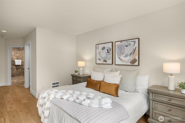 220 1st St Unit 204, Kirkland, WA 98033 - bedroom with light wood-style flooring and baseboards