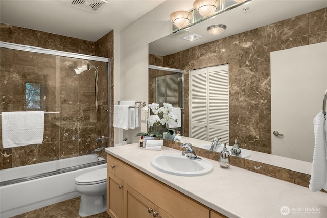 220 1st St Unit 204, Kirkland, WA 98033 - bathroom with vanity and shower / bath combination with glass door