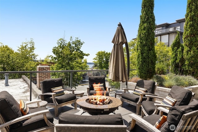 220 1st St Unit 204, Kirkland, WA 98033 - view of patio with an outdoor living space with a fire pit